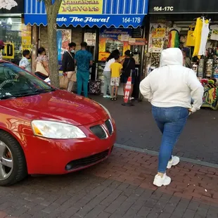 a red car parked on the side of the road