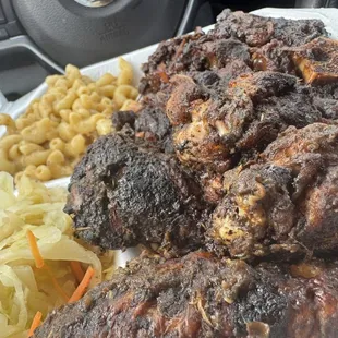 Mac &amp; cheese, cabbage, oxtail, and jerk wings