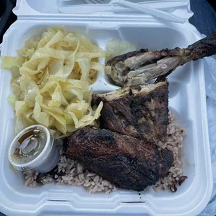 Jerk Chicken dinner with cabbage and Rice &amp; Peas