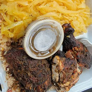 Jerk chicken with the best cabbage I have ever eaten and some killer red beans and rice.