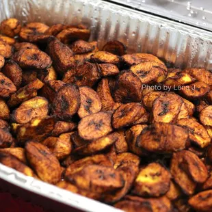 Fried Plantains ($82 for full pan) - Sliced ripe plantains lightly fried
