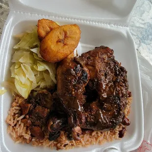 Jerk chicken, fried plaintain rice and steamed cabbage