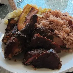 Jerk Chicken and jerk pork and rice and peas