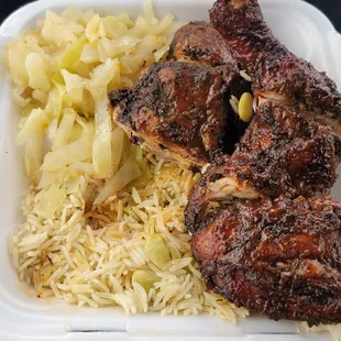 Large jerk chicken plate with cabbage and rice and beans