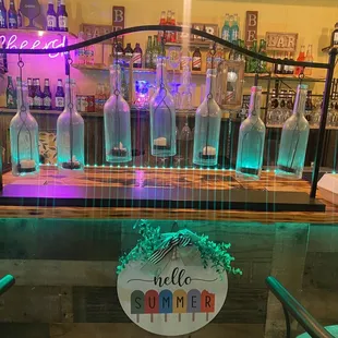 a bar with bottles of alcohol
