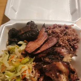 Jerk chicken combo with oxtail,  rice and beans,  cabbage and plantain.