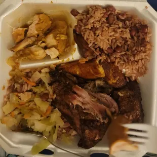 Jerk chicken combo with curry chicken and rice and beans, cabbage and plantain