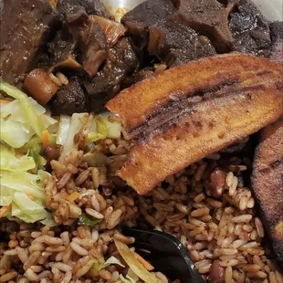 Oxtail cabbage rice and peas and plantain