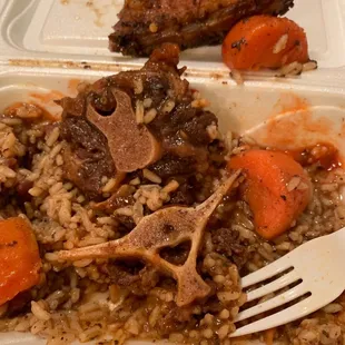 The oxtail is tender and jerk chicken is just ok