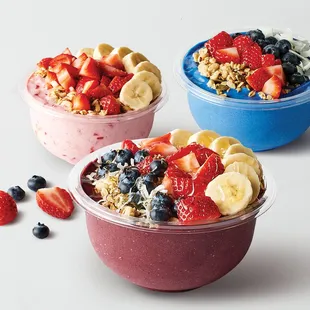 three bowls of fruit and yogurt