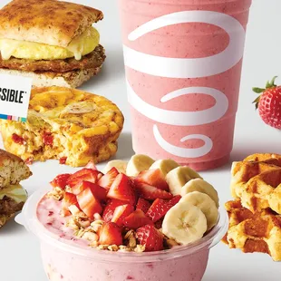 a variety of breakfast foods including waffles, ice cream, and fruit