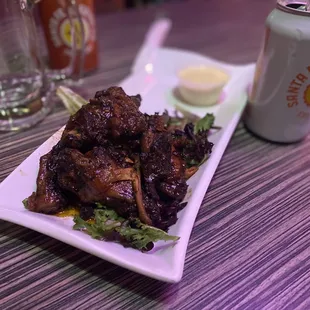 a plate of food and a can of beer