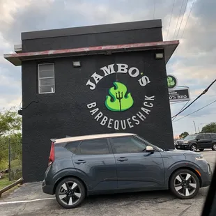 a car parked in front of the restaurant