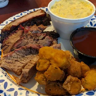 Moist brisket, rib, fried okra, potato salad, bbq sauce. This was only part of my to-go order.