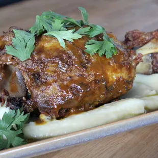 Braised pork shank with lambrusco-mustard glaze, potato puree, and aromatic jus