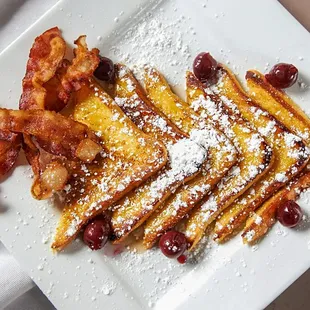 French toast with a side of bacon.