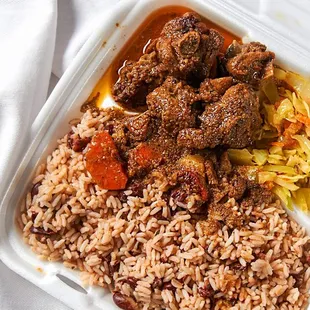 Stew chicken with rice and peas and steam cabbage