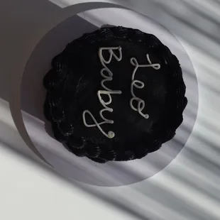 a black cake with white icing