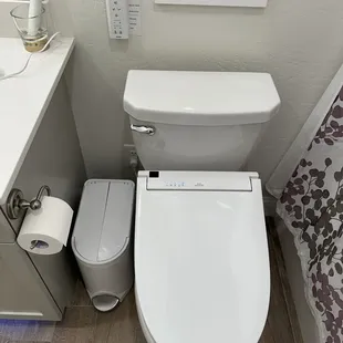 Outlet was installed just behind the trash bin.