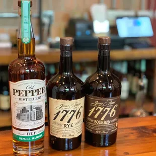 three bottles on a bar