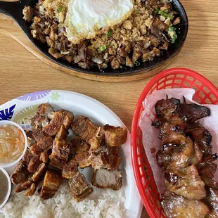 Pork sisig, lechon kawali meal, pork bbq sticks