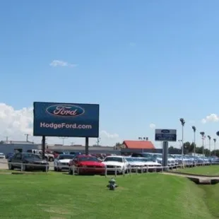 HodgeFord.com sign in front of New Cars.