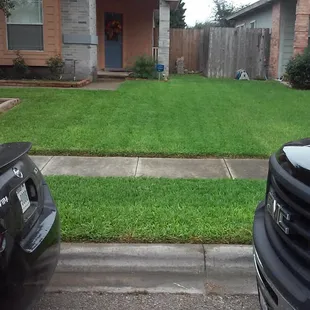 two cars parked in front of a house