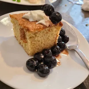Lemon cake with Crème Fraîche, and blue berries in a Balsamic reduction.