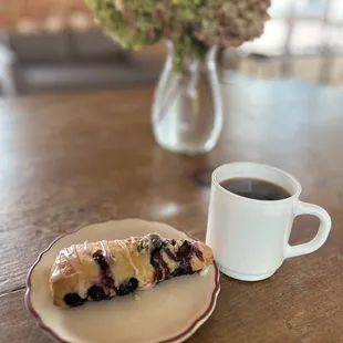 a pastry and a cup of coffee