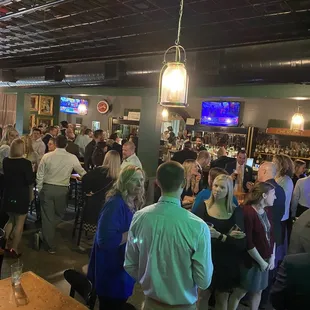 a large group of people at the bar