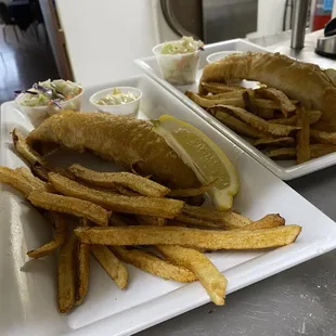 two plates of fish and chips