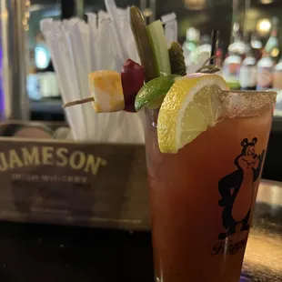a bloody drink with a garnish