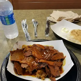 a plate of pulled pork with gravy