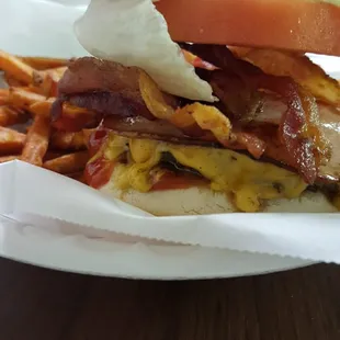 a bacon, egg, tomato, and cheese sandwich