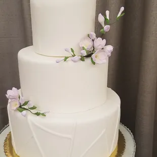a three tiered white wedding cake