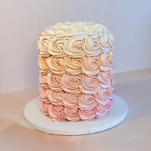 a pink and white cake