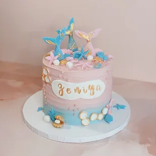 a pink and blue birthday cake