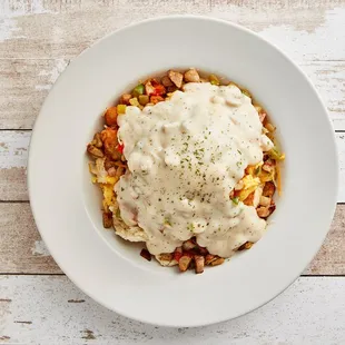 a plate of food with a creamy sauce