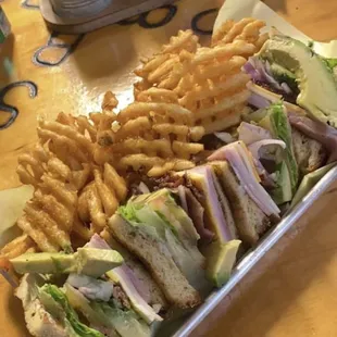 Club sandwich with waffle fries