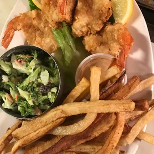 a plate of fried shrimp and fries