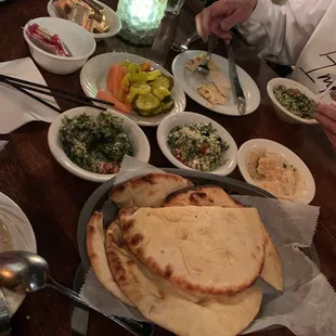 The setup that comes with your dinner. Tabouli, hummus, pita bread, and a relish dish! YUM!