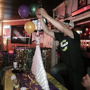 a man holding up balloons
