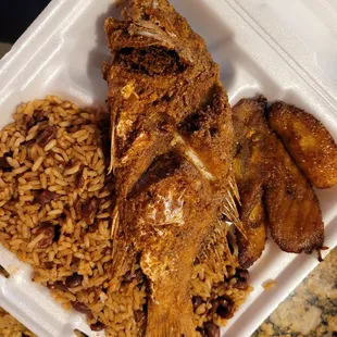 Red snapper, peas and rice and plantain close-up.