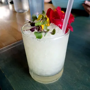 a drink with flowers in it