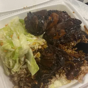 Brown Stew Chicken with Rice and Peas and cabbage