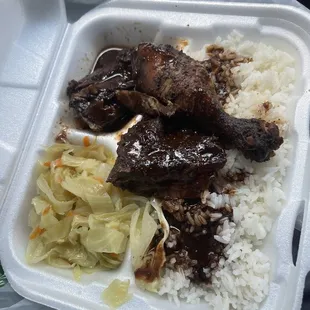 Lunch special Jerk chicken Steamed Cabbage White Rice