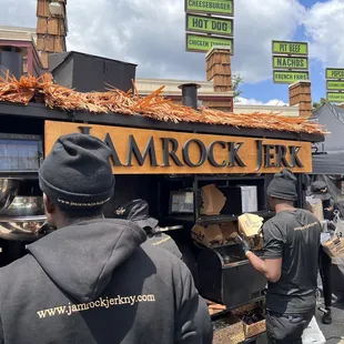 a man preparing food at a food truck