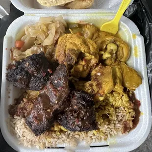 Jerk Chicken &amp; Curry Chicken over rice &amp; peas. Cabbage.