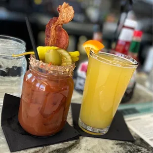 a glass of juice and bacon
