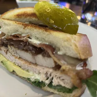 a chicken sandwich with pickles